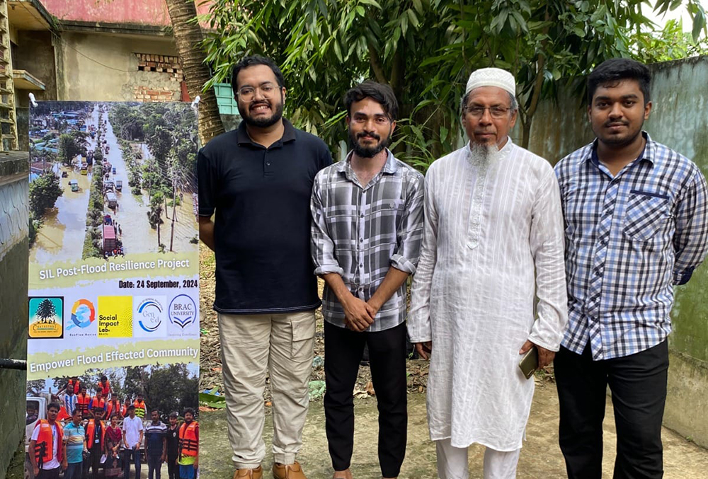 Students standing with elder outside