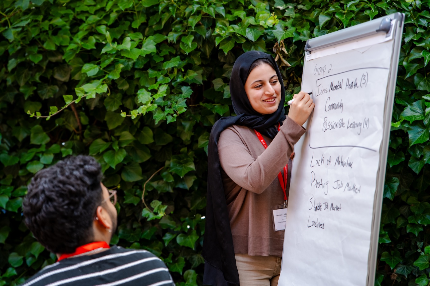 Student writing on a board