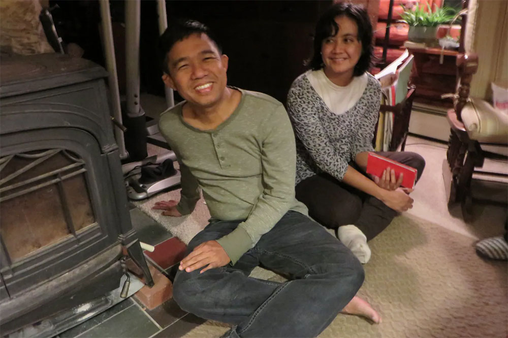 Bo Bo Nge sitting on the floor smiling