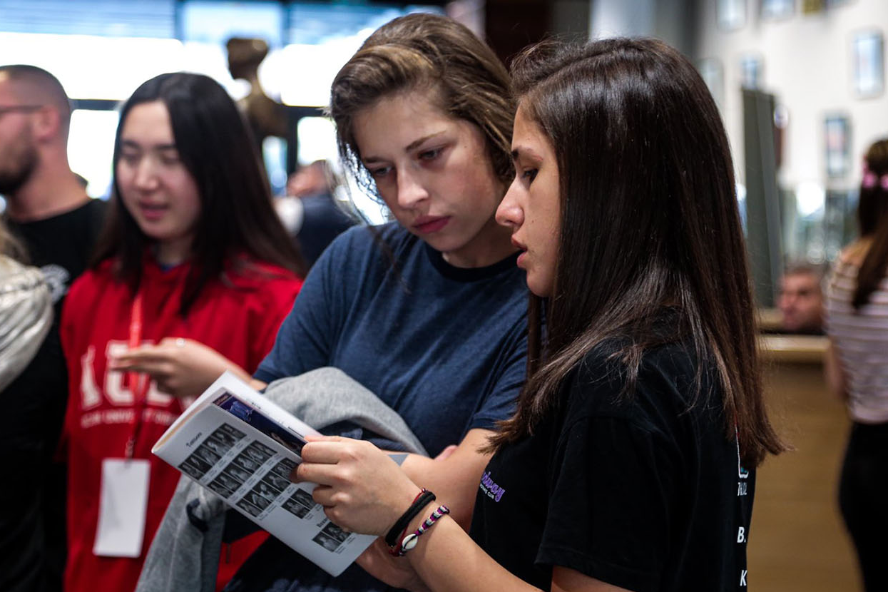 Two students looking at a magazing