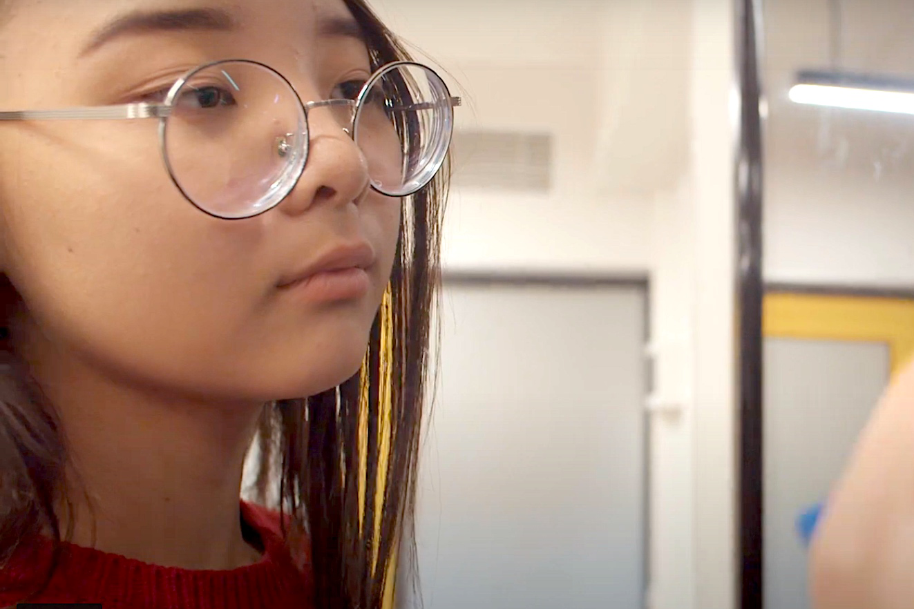 Student writing on a board