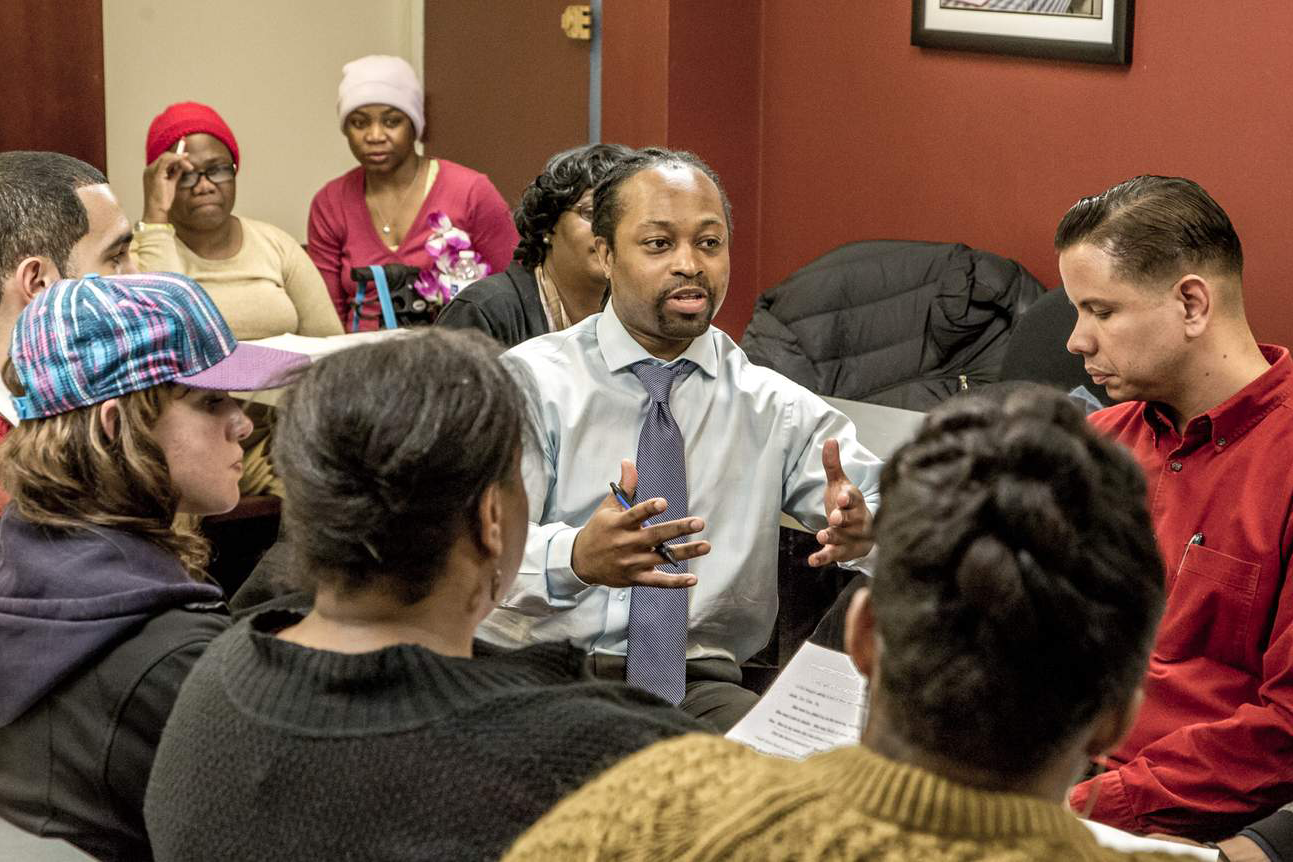 Work group with man talking in the center