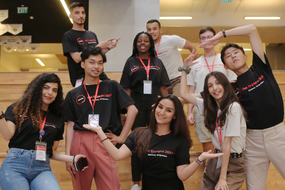 Fellows posing on steps at Get Engaged Conference