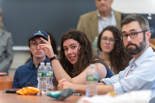 Woman raising her hand during a lesson