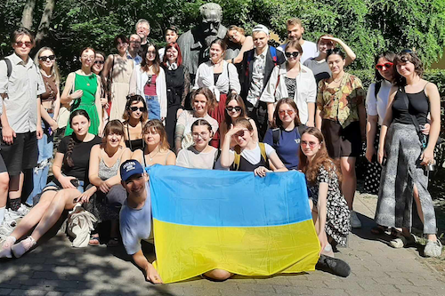 IUU students posing with a Ukrainian flag