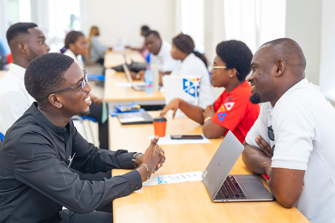 Two men talking with each other at a fair