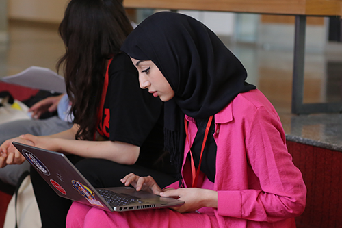 Girl working on her laptop at get engaged conference