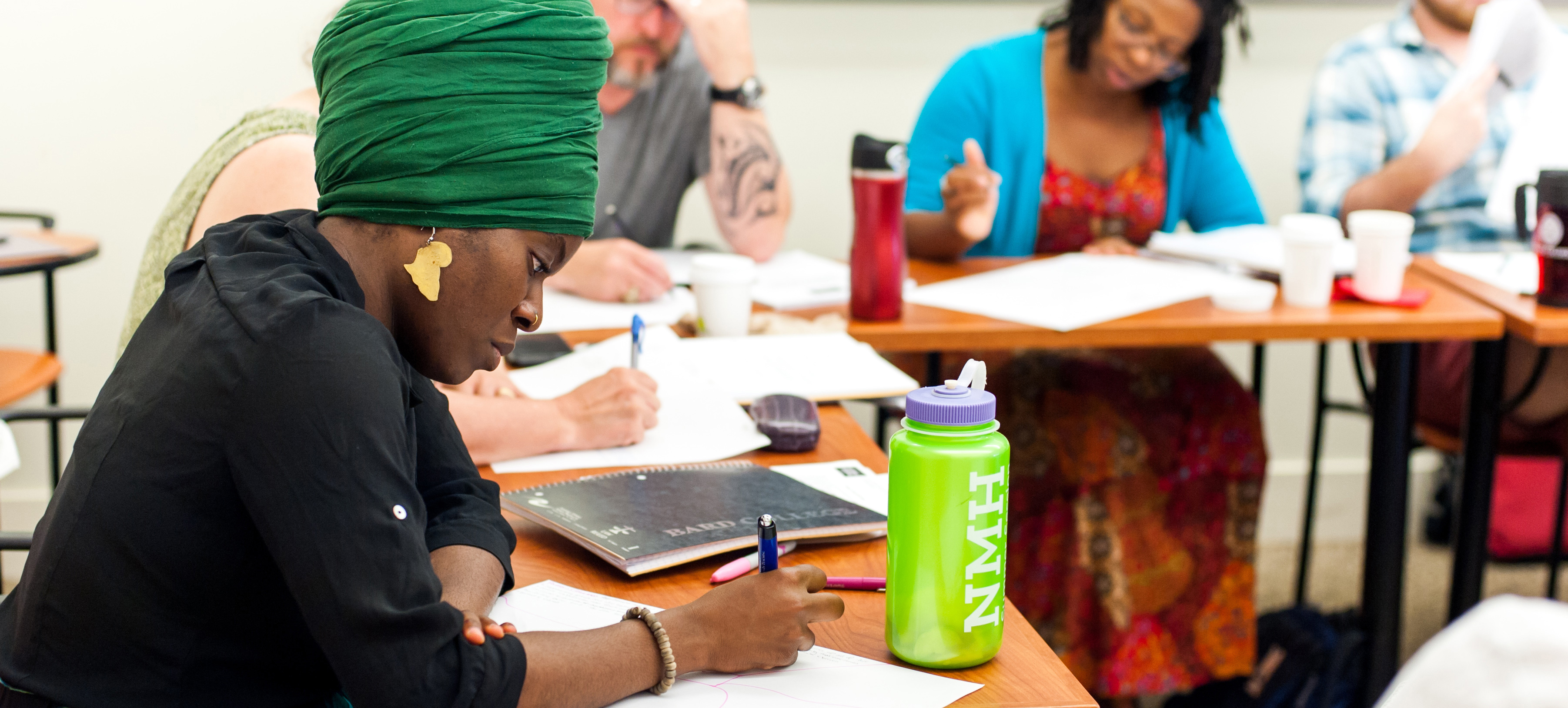Woman writing in notepad