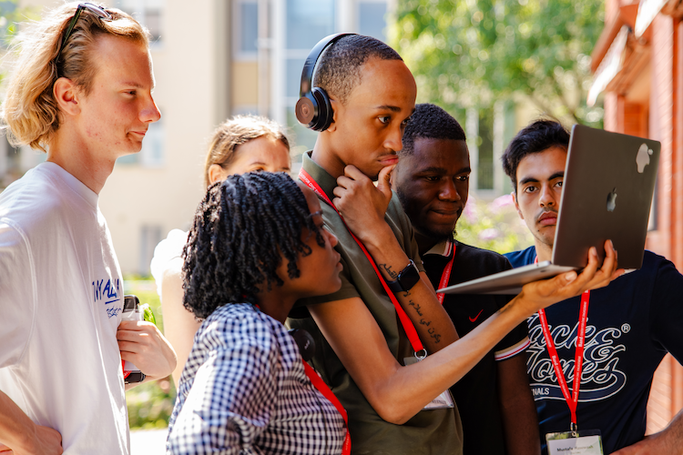 Students looking at a laptop